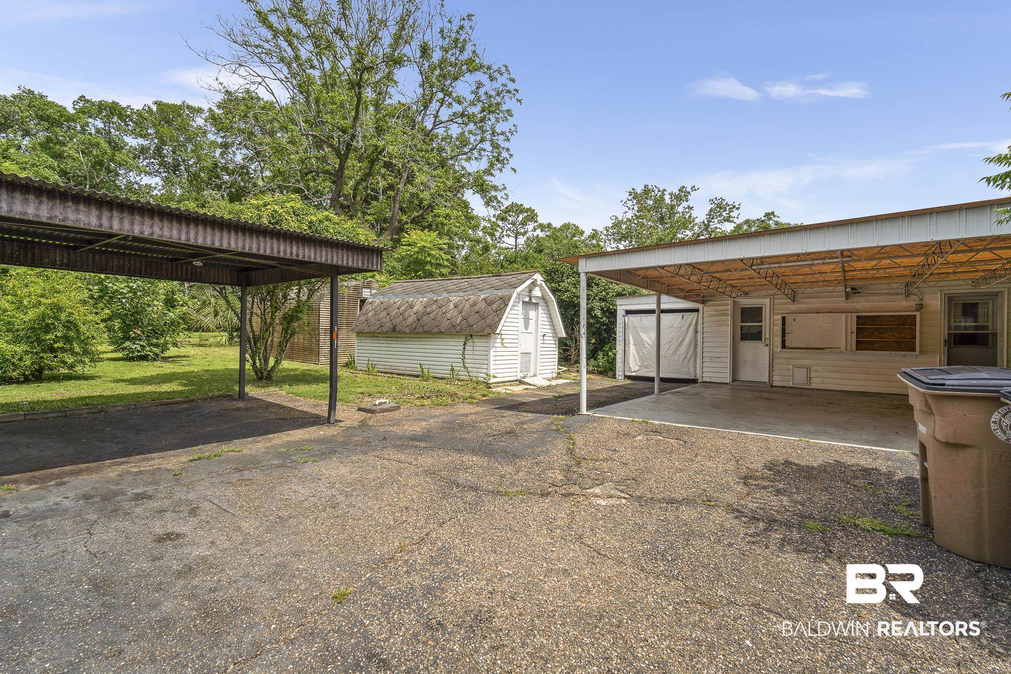 2710 Longleaf Drive Mobile, AL 36693 - Photo 22 of 27 View of car parking with a carport