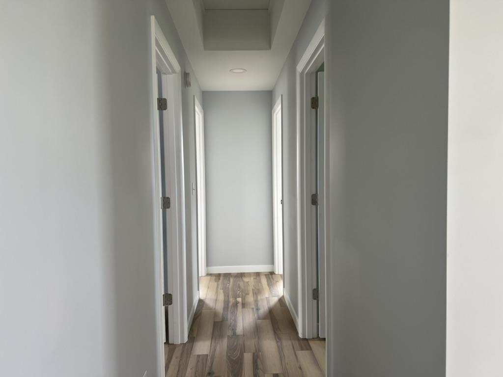35 Field Road Silver Bay, MN 55614 - Photo 8 of 20 Hallway featuring wood-type flooring and baseboards