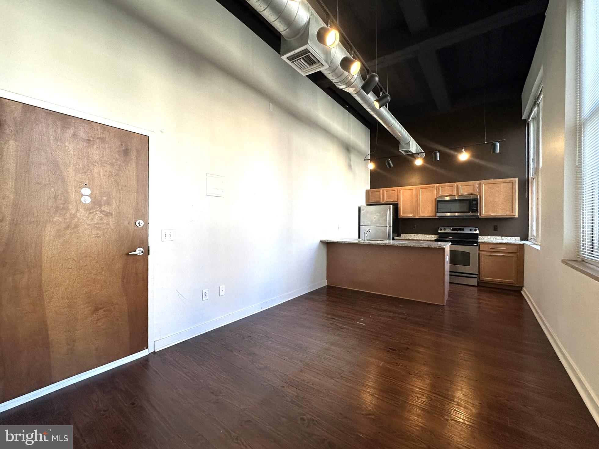1510 Chestnut Street, Unit 902 Philadelphia, PA 19102 - Photo 6 of 19 a view of a kitchen with a sink and cabinets