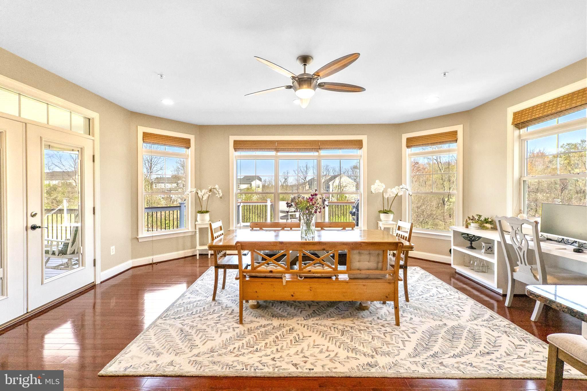 18004 Bliss Drive Poolesville, MD 20837 - Photo 11 of 57 a living room with furniture and a large window