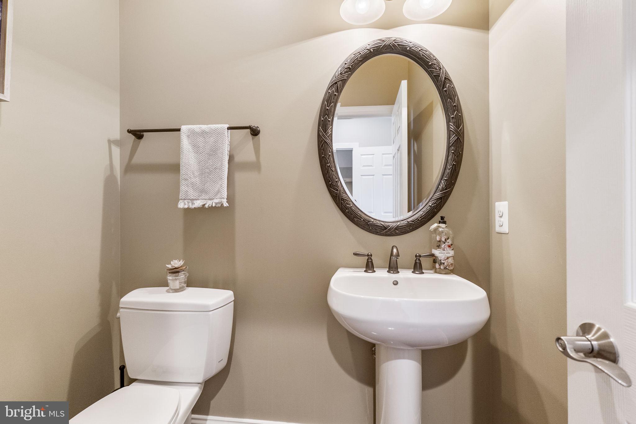 18004 Bliss Drive Poolesville, MD 20837 - Photo 13 of 57 a bathroom with a sink and a mirror