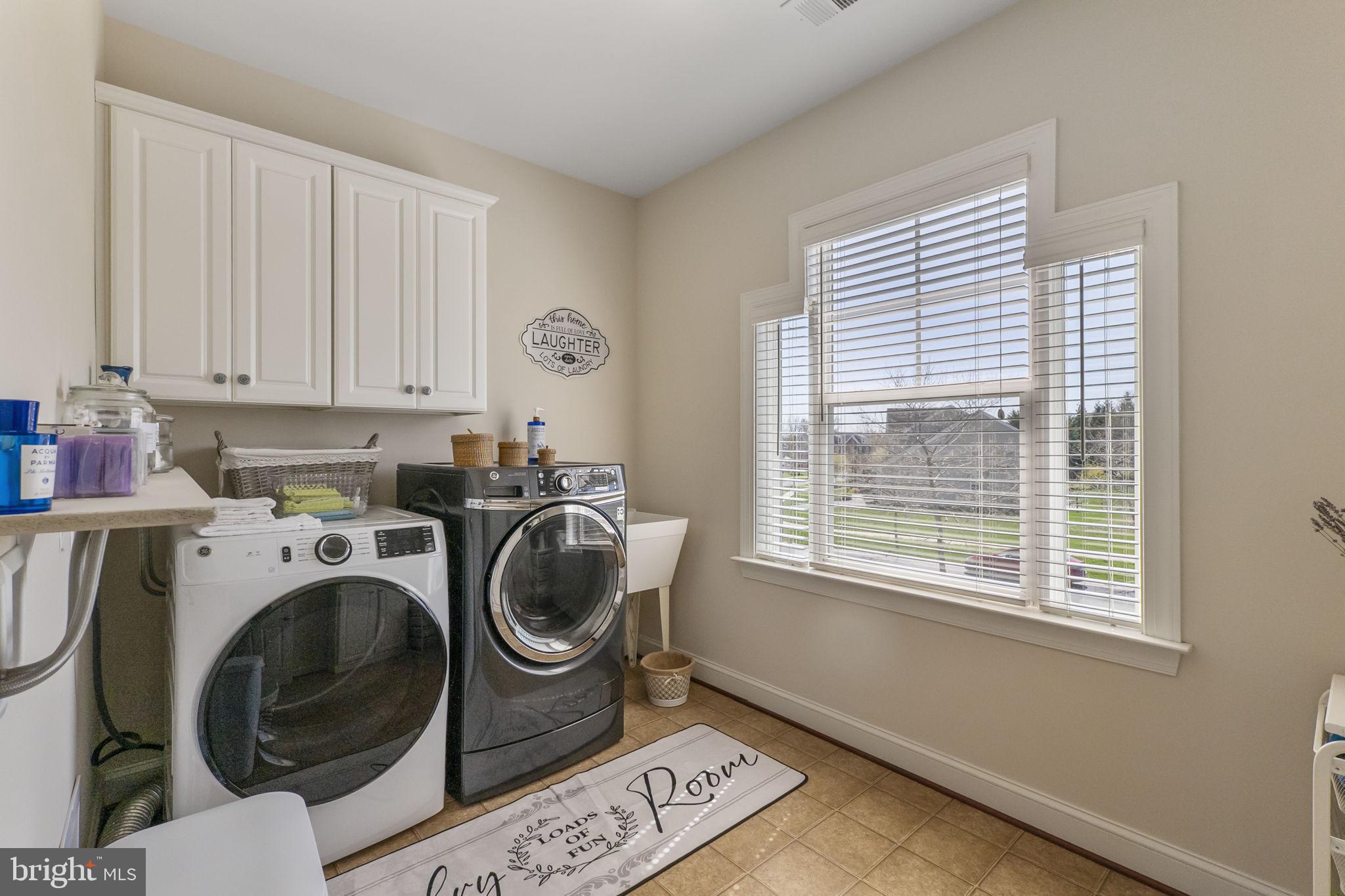18004 Bliss Drive Poolesville, MD 20837 - Photo 30 of 57 a utility room with dryer and washer