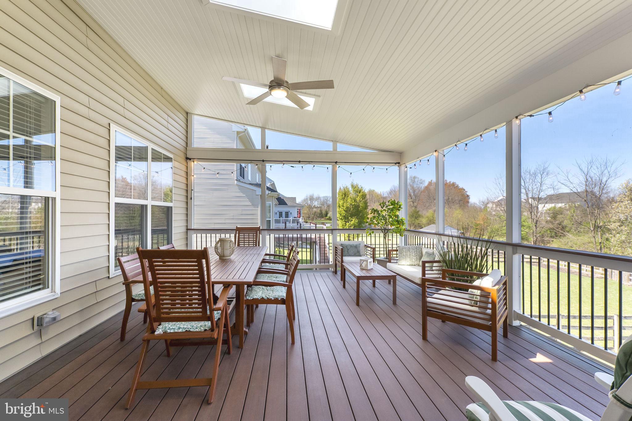 18004 Bliss Drive Poolesville, MD 20837 - Photo 31 of 57 a balcony with furniture and wooden floor