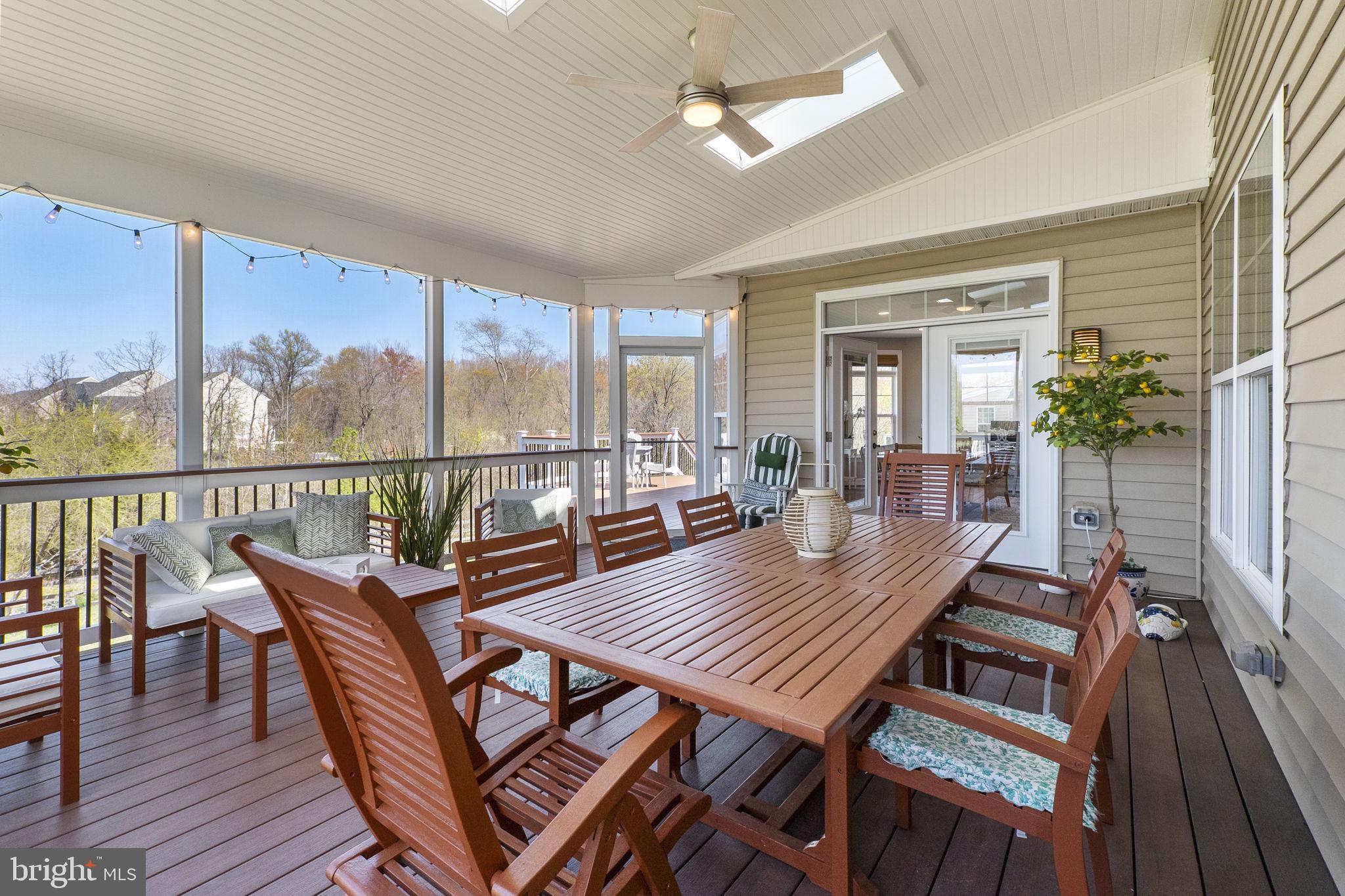 18004 Bliss Drive Poolesville, MD 20837 - Photo 32 of 57 a view of a dining room with furniture window and wooden floor