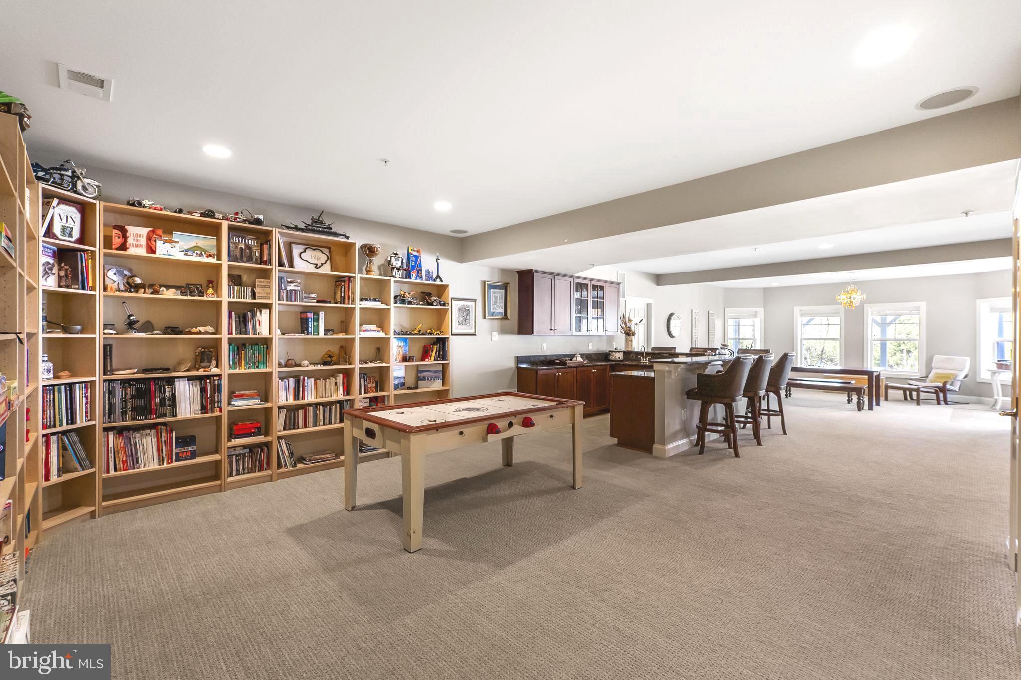 18004 Bliss Drive Poolesville, MD 20837 - Photo 38 of 57 a living room with furniture a rug and gym equipment