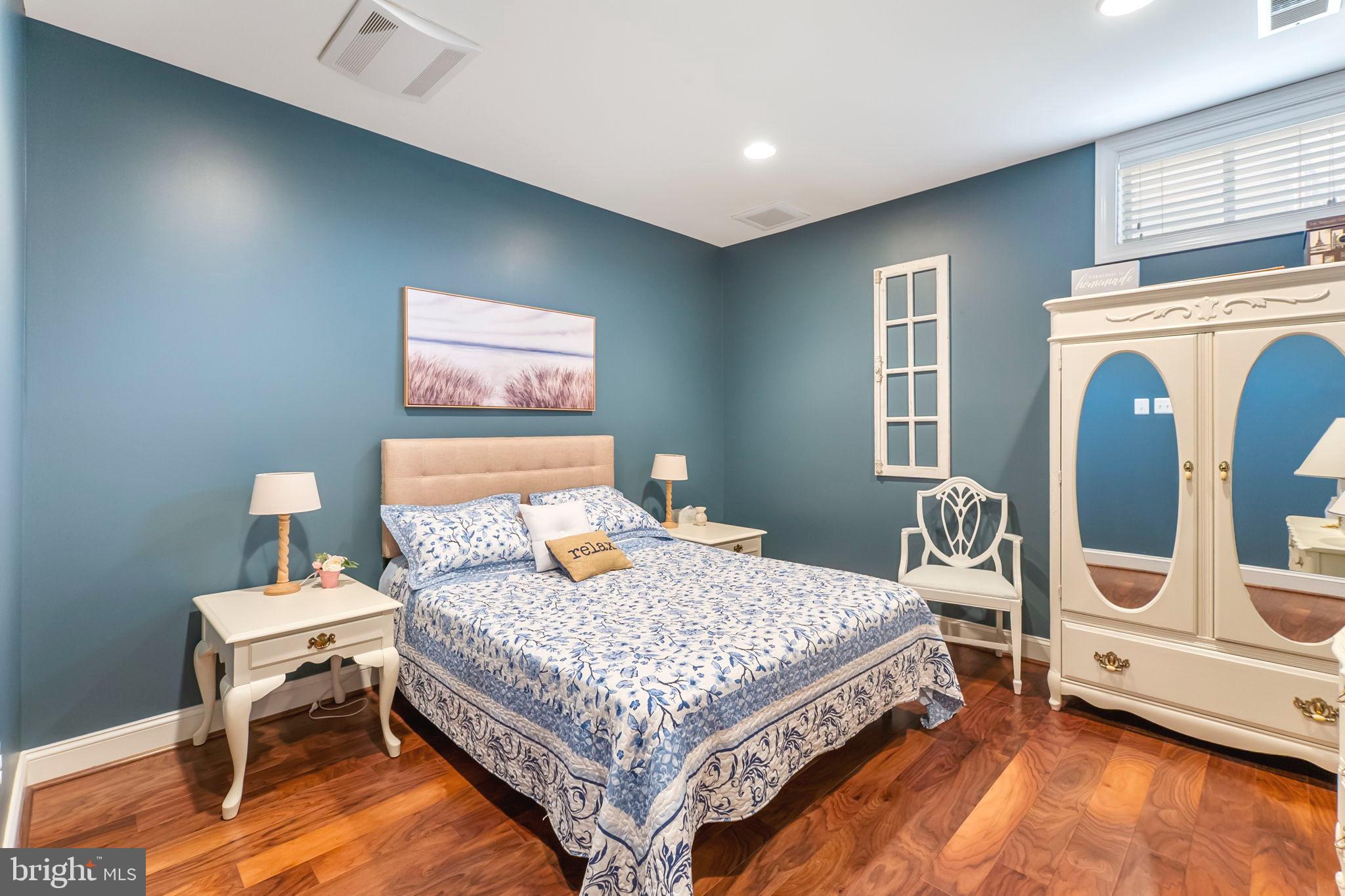 18004 Bliss Drive Poolesville, MD 20837 - Photo 43 of 57 a bedroom with a bed and wooden floor