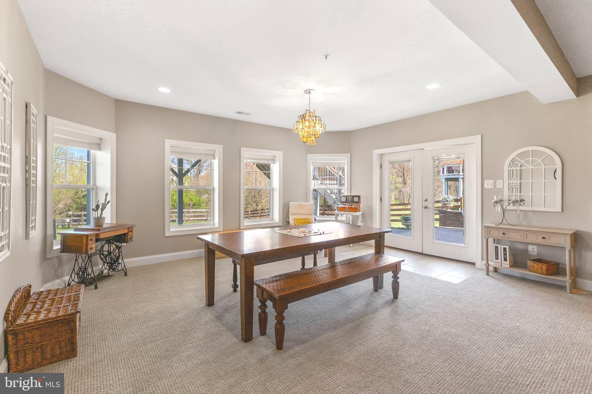 18004 Bliss Drive Poolesville, MD 20837 - Photo 44 of 57 a living room with furniture and a table