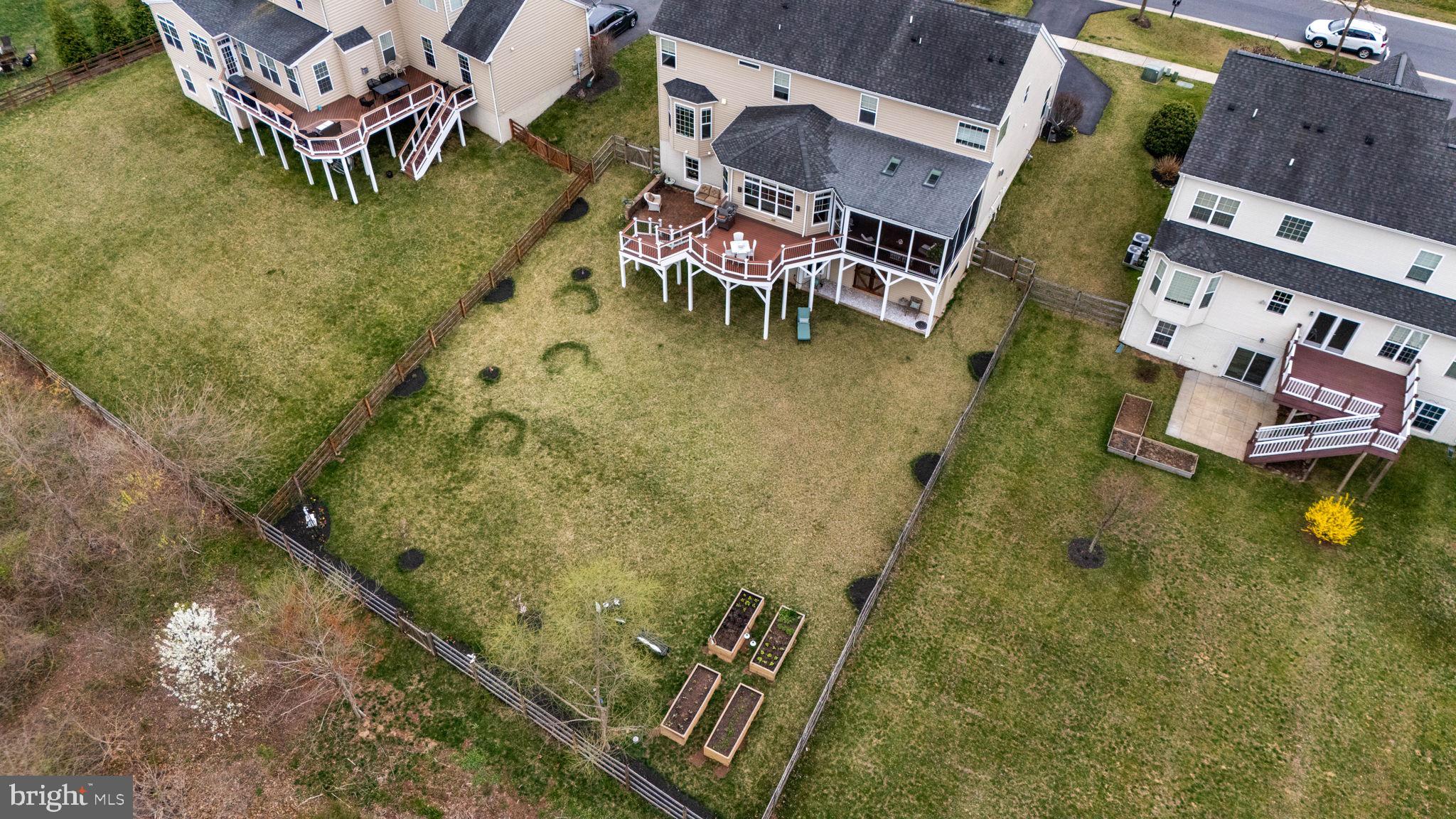 18004 Bliss Drive Poolesville, MD 20837 - Photo 51 of 57 an aerial view of a house with swimming pool a yard and a garage