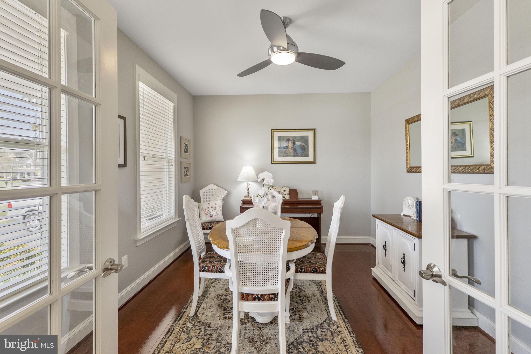18004 Bliss Drive Poolesville, MD 20837 - Photo 7 of 57 a view of a dining room with furniture window and wooden floor