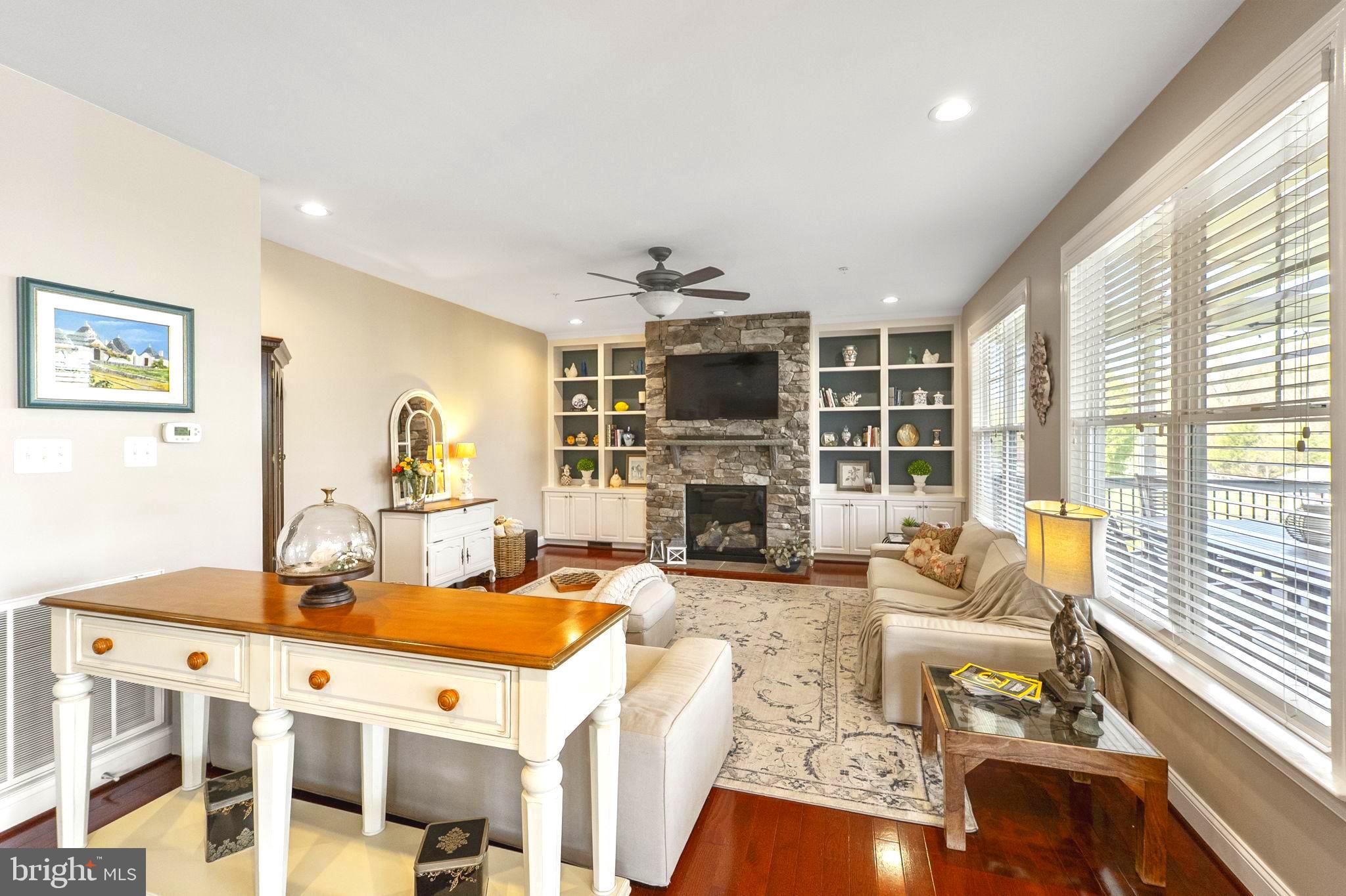 18004 Bliss Drive Poolesville, MD 20837 - Photo 10 of 57 a living room with fireplace furniture and a flat screen tv