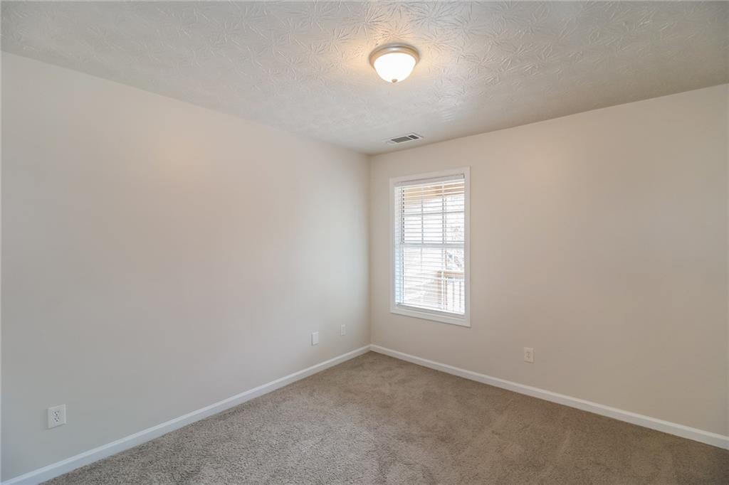 3824 Augustine Place Rex, GA 30273 - Photo 14 of 24 an empty room with windows