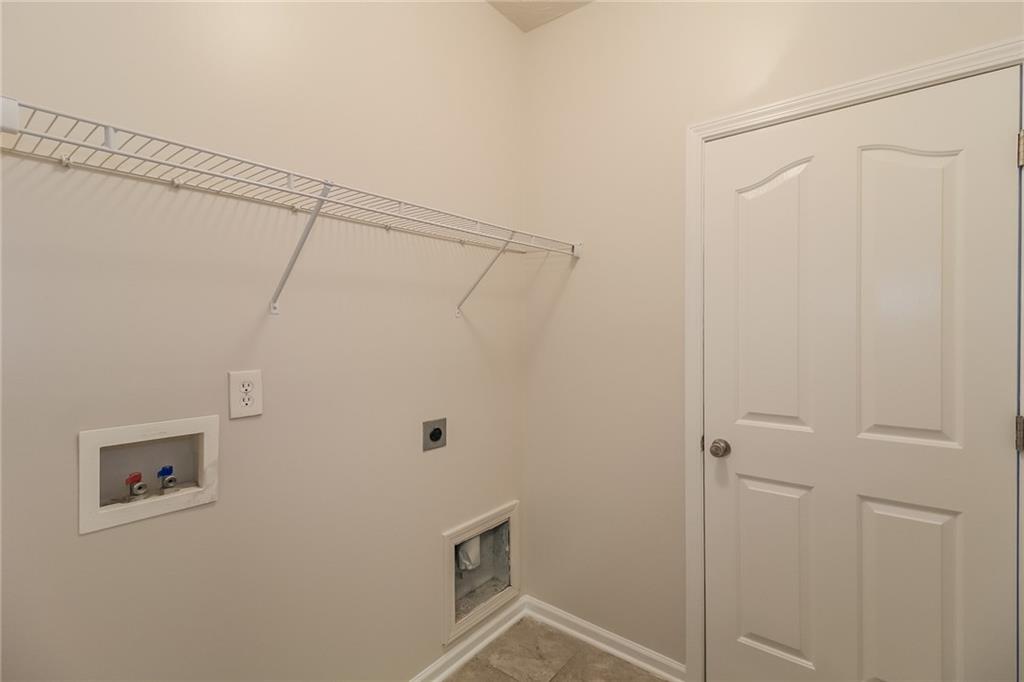 3824 Augustine Place Rex, GA 30273 - Photo 19 of 24 a bathroom with a shower and a shower head