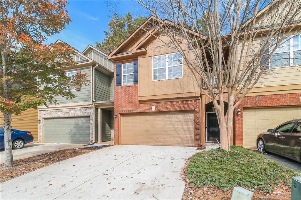 3824 Augustine Place Rex, GA 30273 - Photo 2 of 24 a front view of a house with a yard and garage
