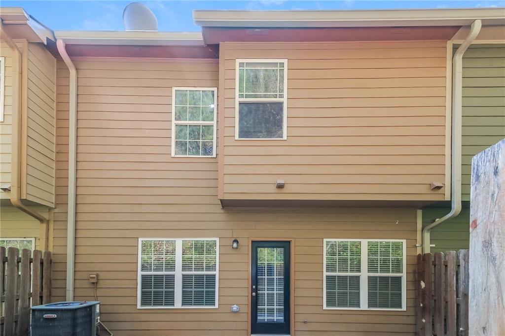 3824 Augustine Place Rex, GA 30273 - Photo 22 of 24 a view of a brick house with large windows