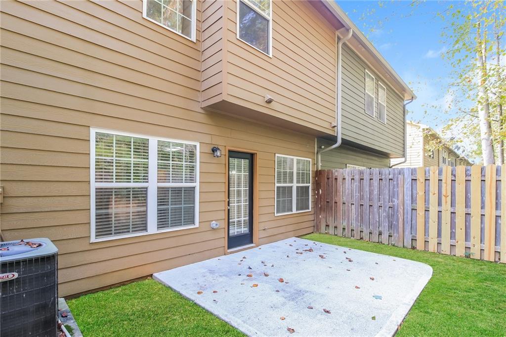 3824 Augustine Place Rex, GA 30273 - Photo 24 of 24 a front view of a house with a garden