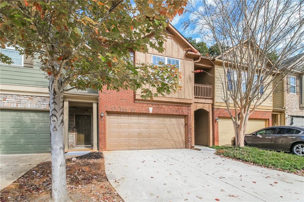 3824 Augustine Place Rex, GA 30273 - Photo 3 of 24 a front view of a house with a yard and garage