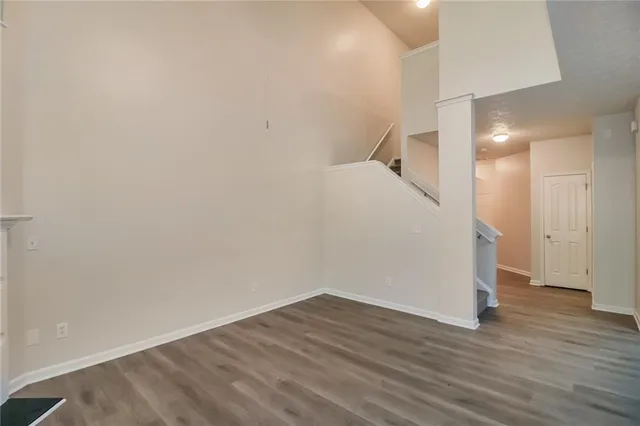 a view of a room with wooden floor