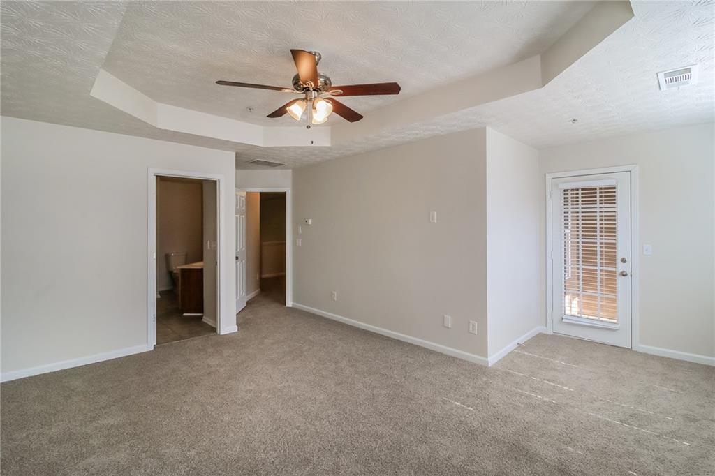 3824 Augustine Place Rex, GA 30273 - Photo 9 of 24 a view of an empty room with a ceiling fan