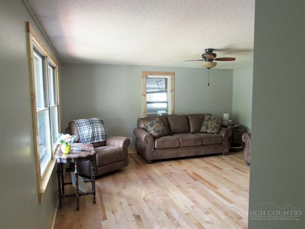 805 Ed Little Road Warrensville, NC 28693 - Photo 30 of 49 a living room with furniture and a window