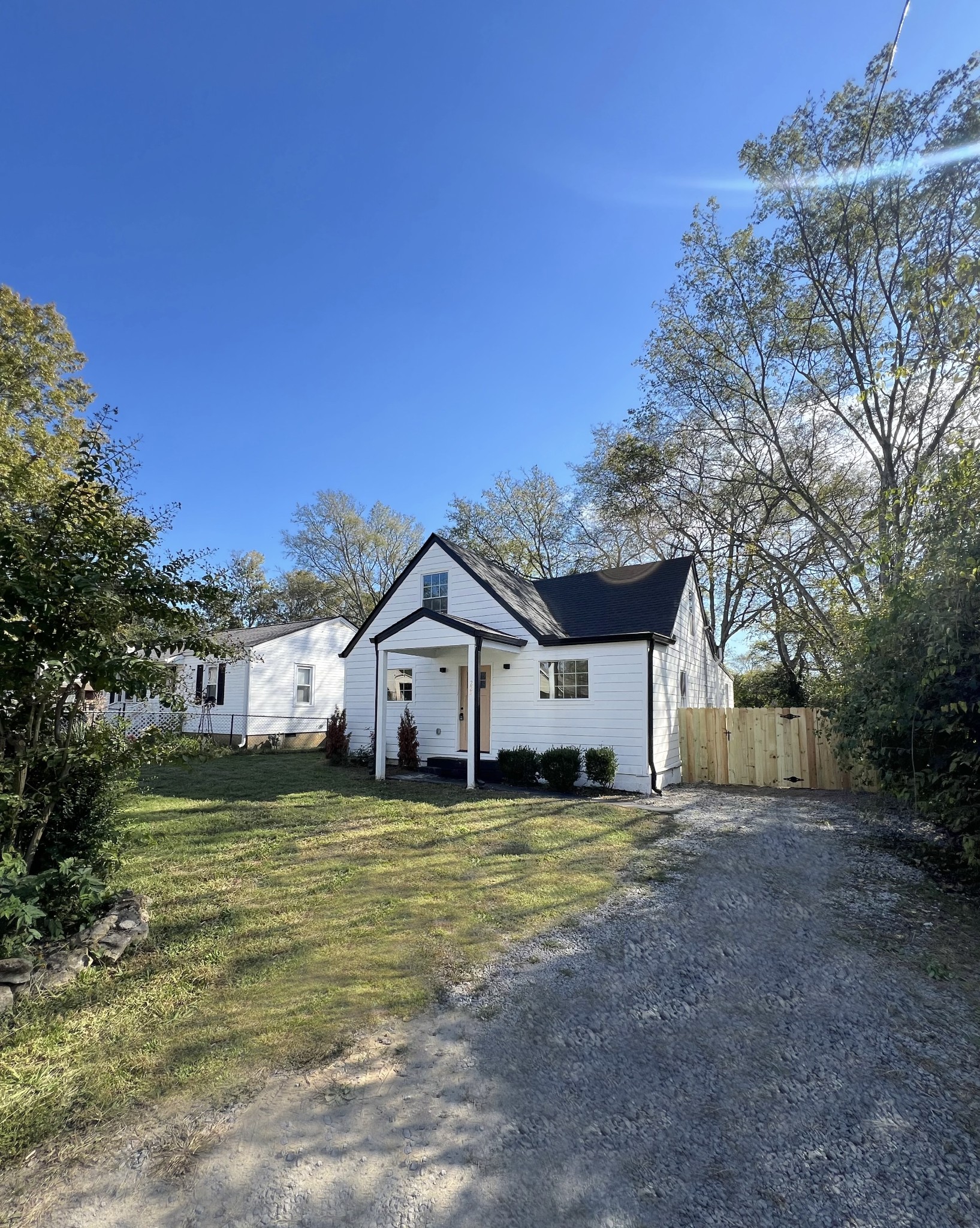 224 Cherry Street Madison, TN 37115 - Photo 2 of 11 a house that is sitting in the middle of a field