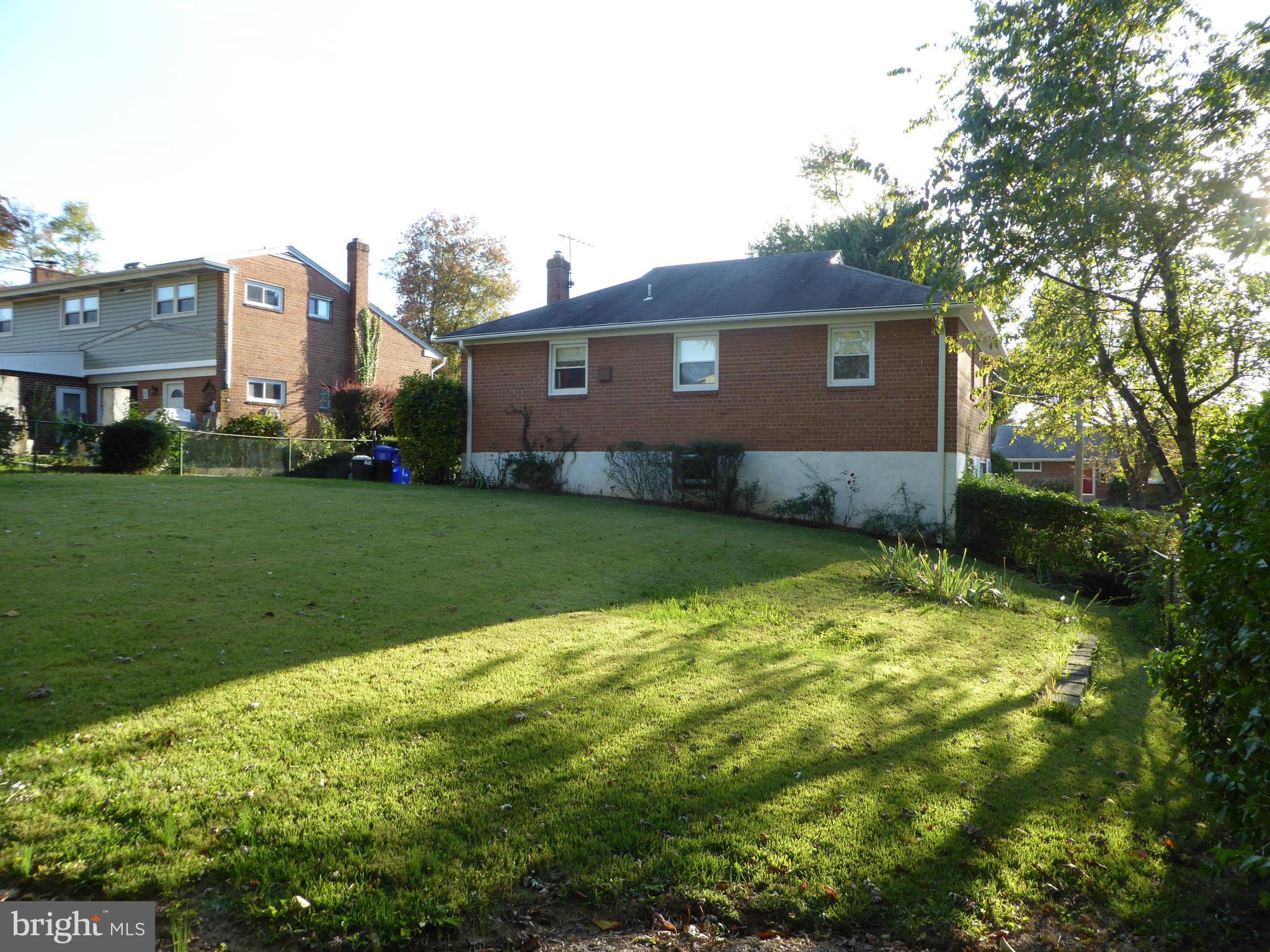 12907 Bluhill Road Silver Spring, MD 20906 - Photo 20 of 20 a view of a house with a backyard