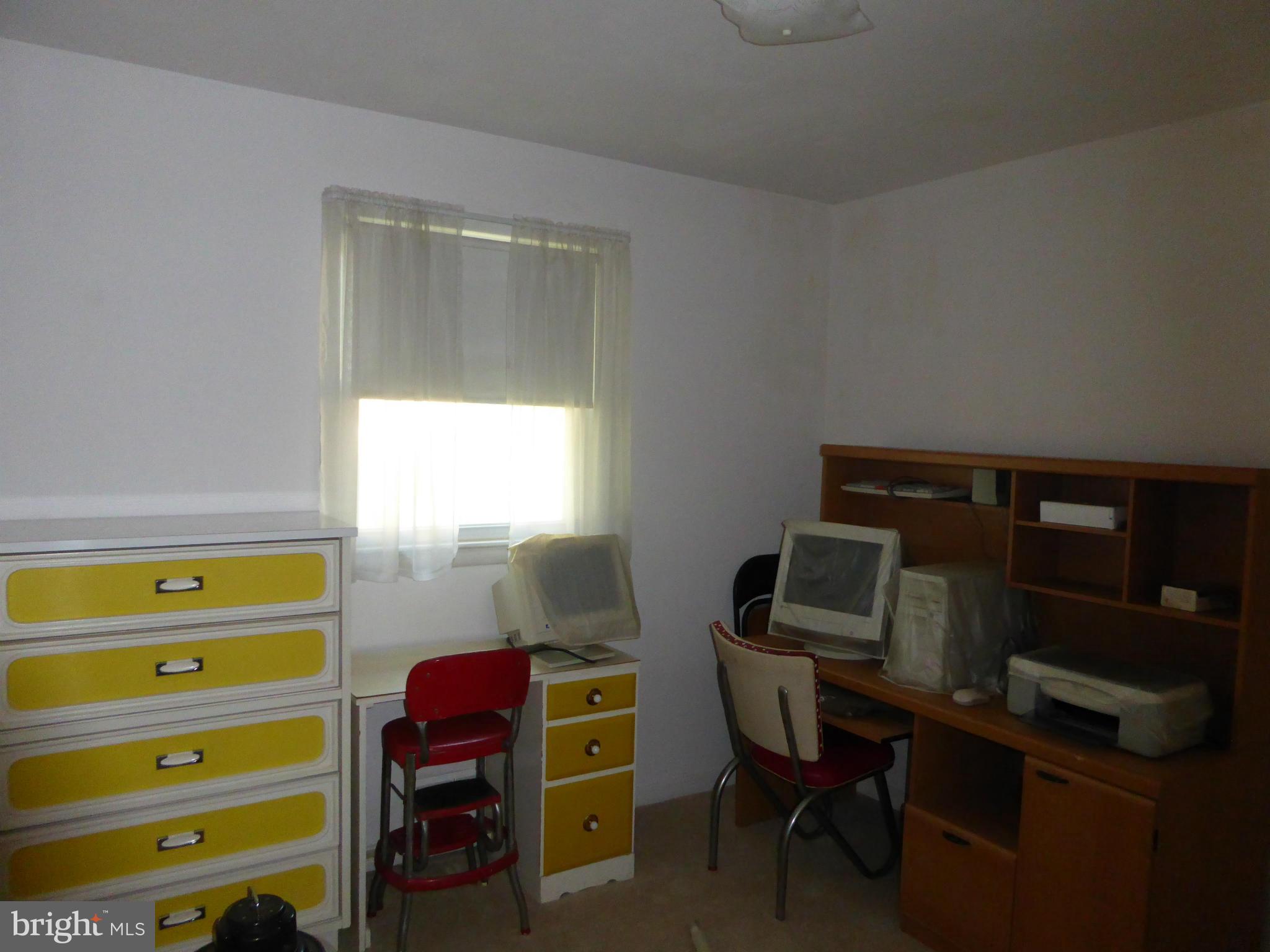 12907 Bluhill Road Silver Spring, MD 20906 - Photo 9 of 20 a room with a bed and a window