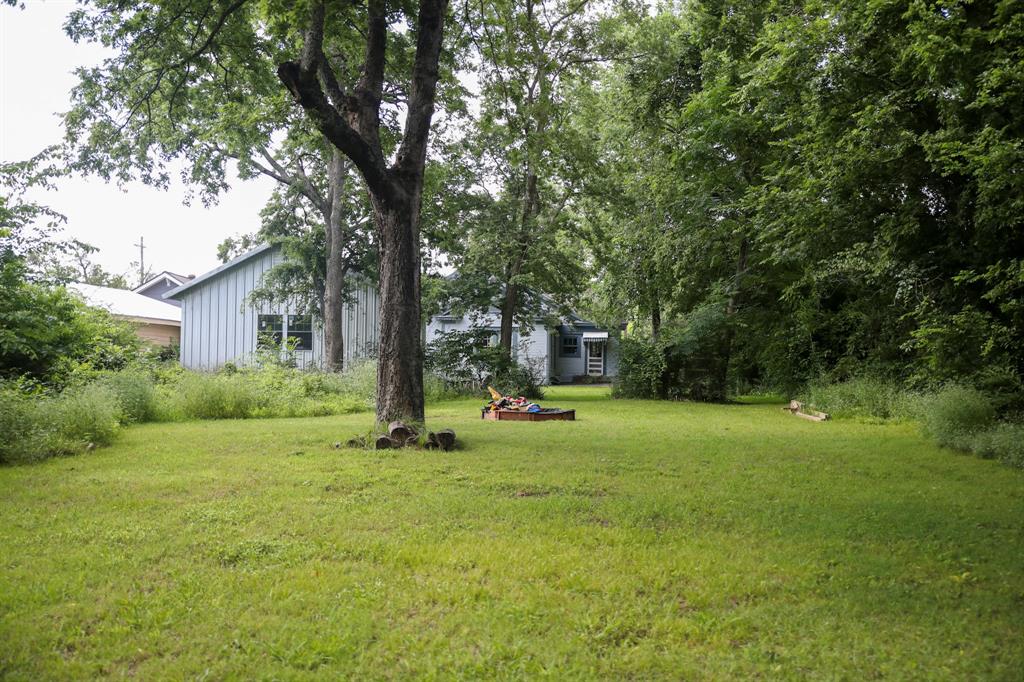 1500 Bonham Street Commerce, TX 75428 - Photo 29 of 29 a view of a house with a backyard