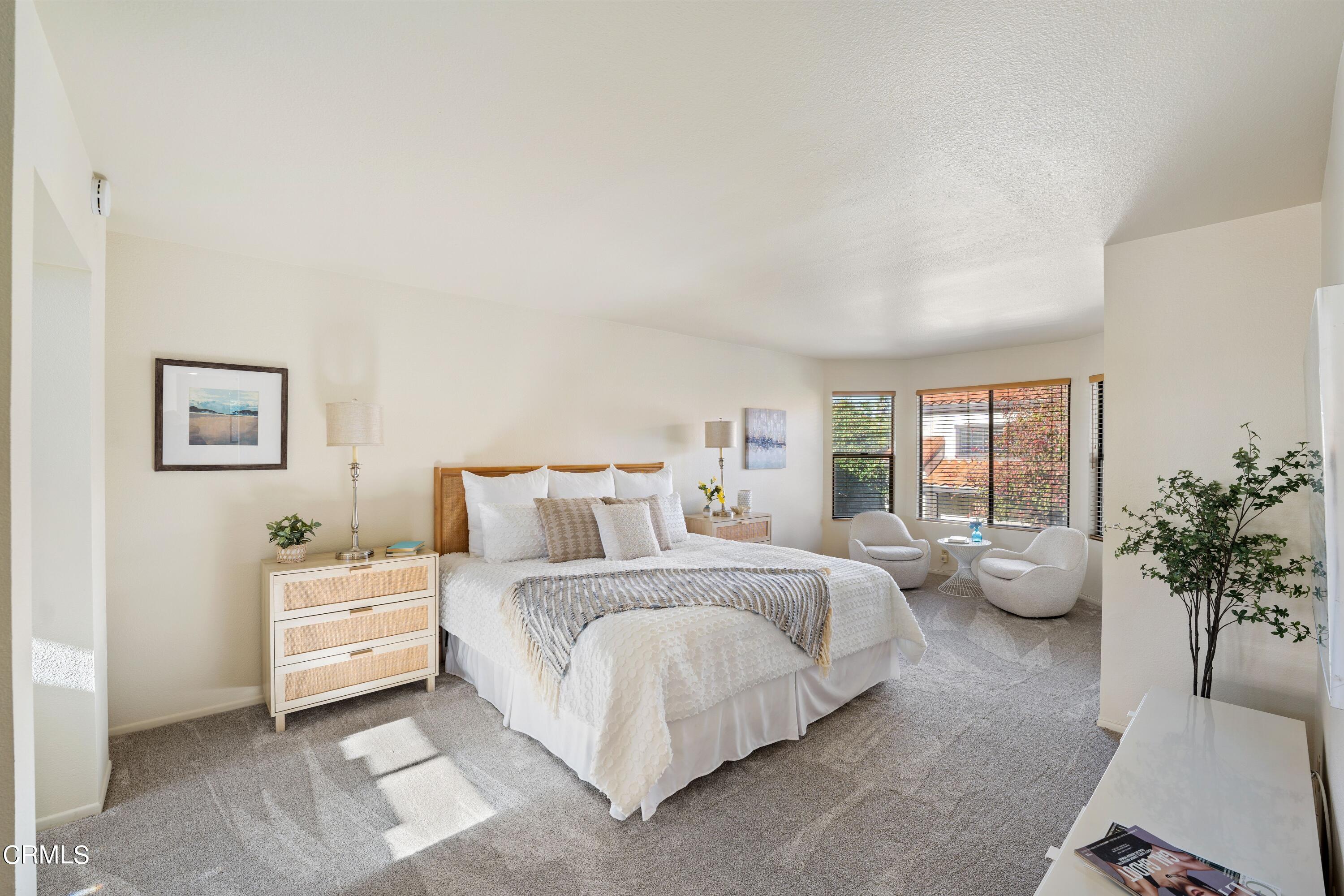 2041 Majorca Drive Oxnard, CA 93035 - Photo 20 of 31 a bedroom with a large bed and a potted plant