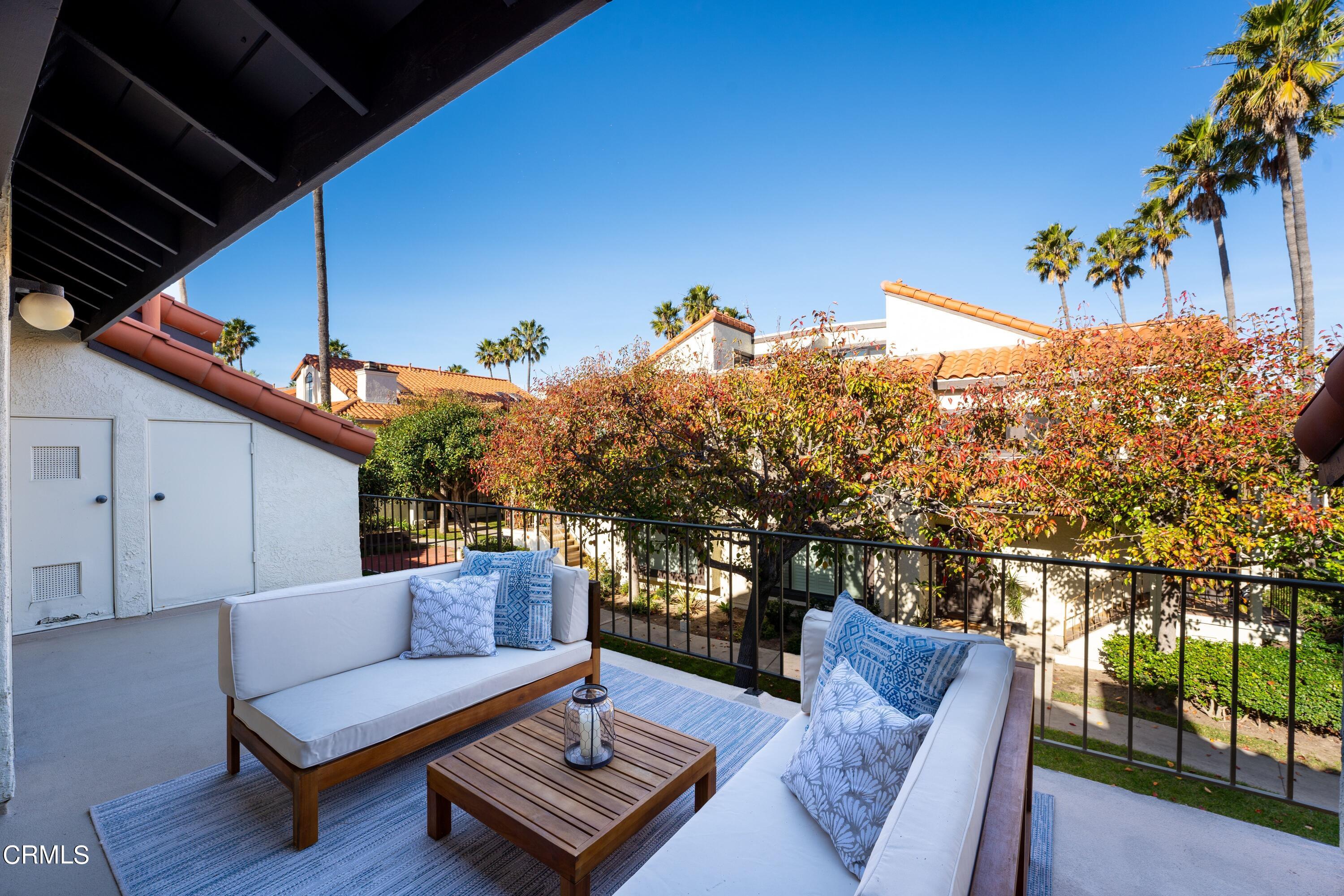 2041 Majorca Drive Oxnard, CA 93035 - Photo 8 of 31 a view of a roof deck with couches and wooden floor