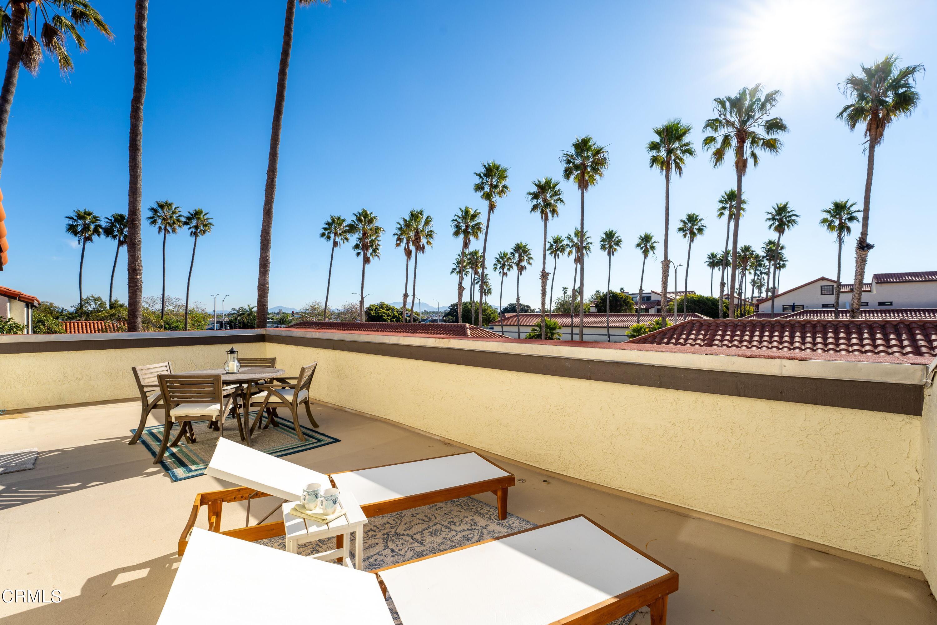 2041 Majorca Drive Oxnard, CA 93035 - Photo 10 of 31 a view of a swimming pool with a table and chairs
