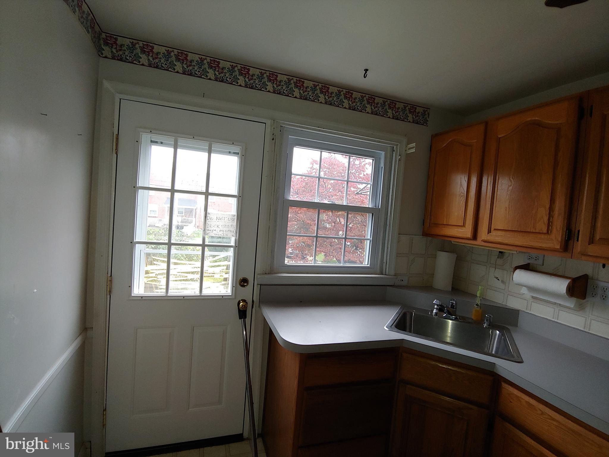 8107 Barksdale Road Towson, MD 21286 - Photo 12 of 55 Kitchen with backdoor leading to large deck area