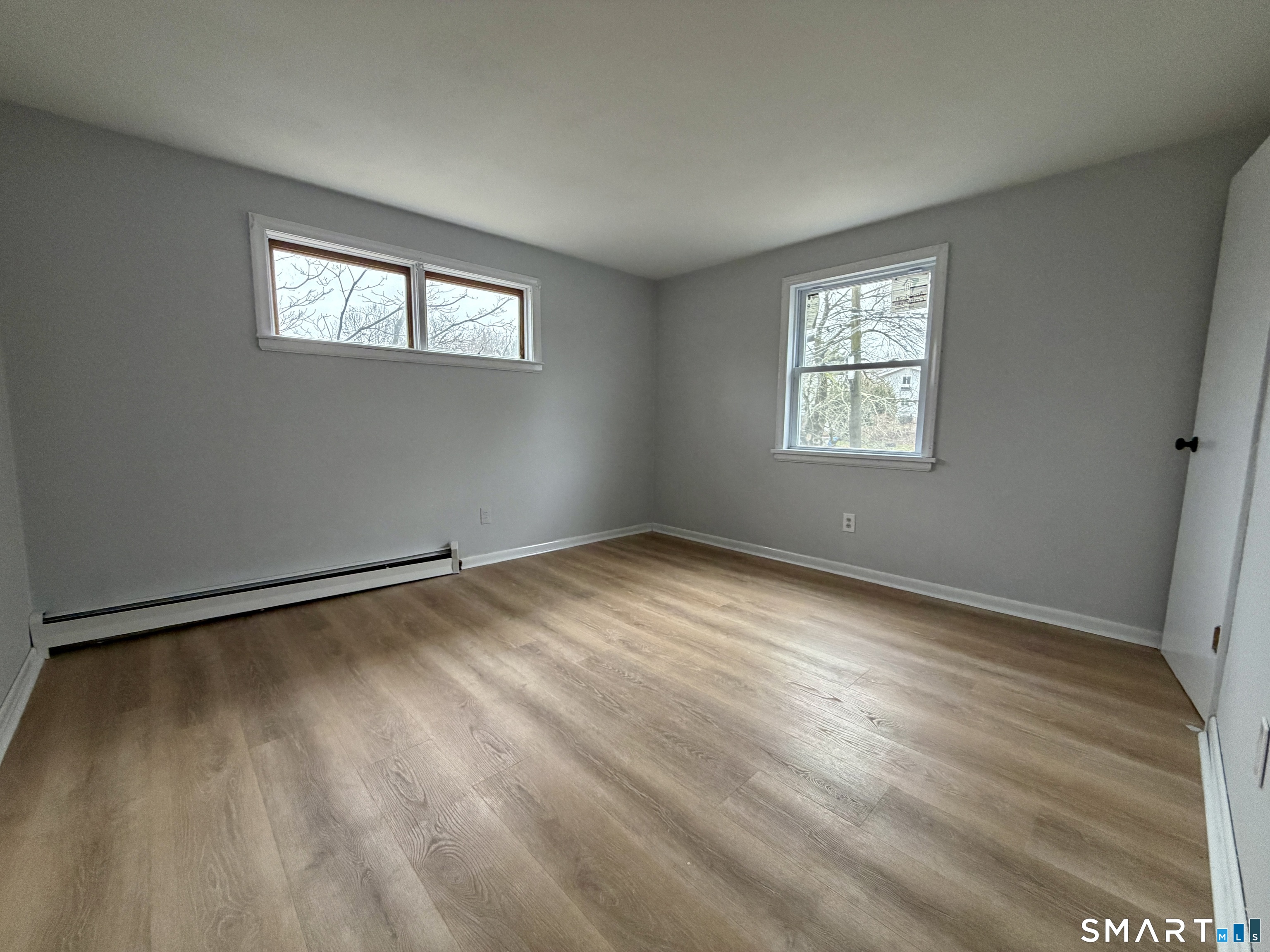 164 Sycamore Street, Unit 2R Bristol, CT 06010 - Photo 10 of 11 a view of an empty room with a window