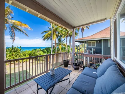 a view of a chairs and table in the patio