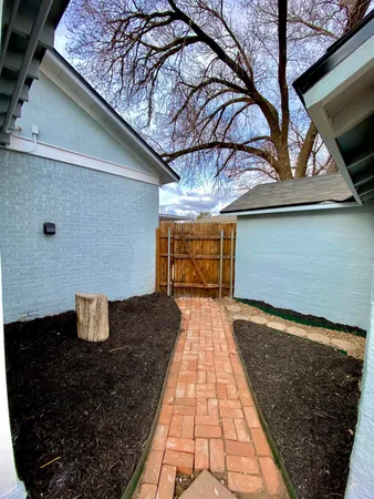a view of a backyard of the house