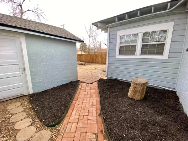 a view of a backyard with sitting area