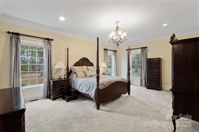 a bedroom with bed and window