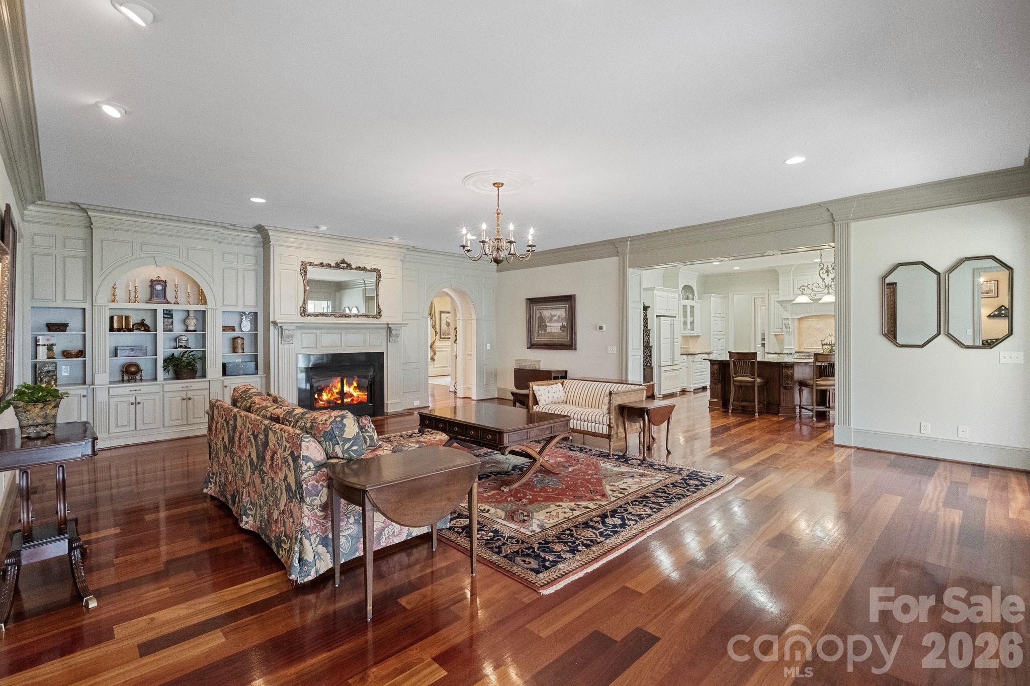 393 Youngs Bend Road Kershaw, SC 29067 - Photo 14 of 48 a living room with fireplace furniture and a chandelier