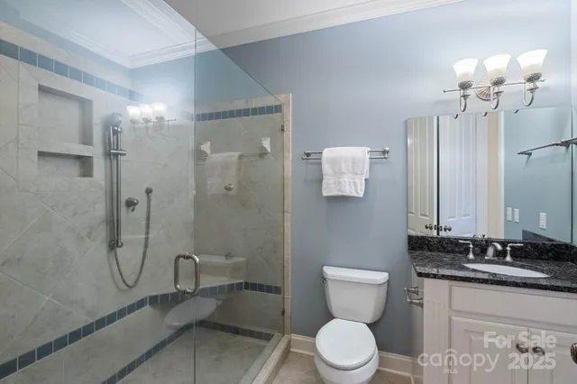 a bathroom with a toilet sink and shower