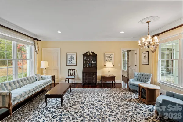 a bedroom with furniture and a window