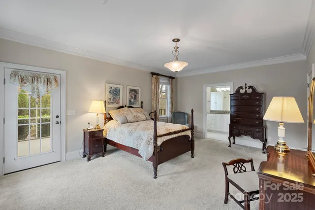 a spacious bedroom with a bed and a window