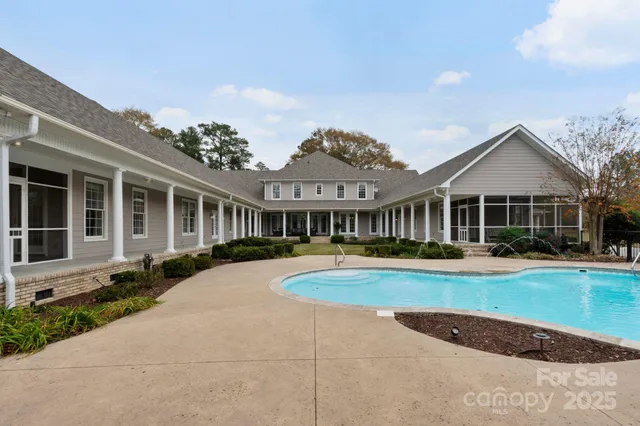 a front view of a house with swimming pool