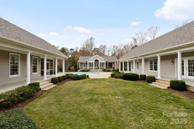 a front view of a house with yard porch and furniture