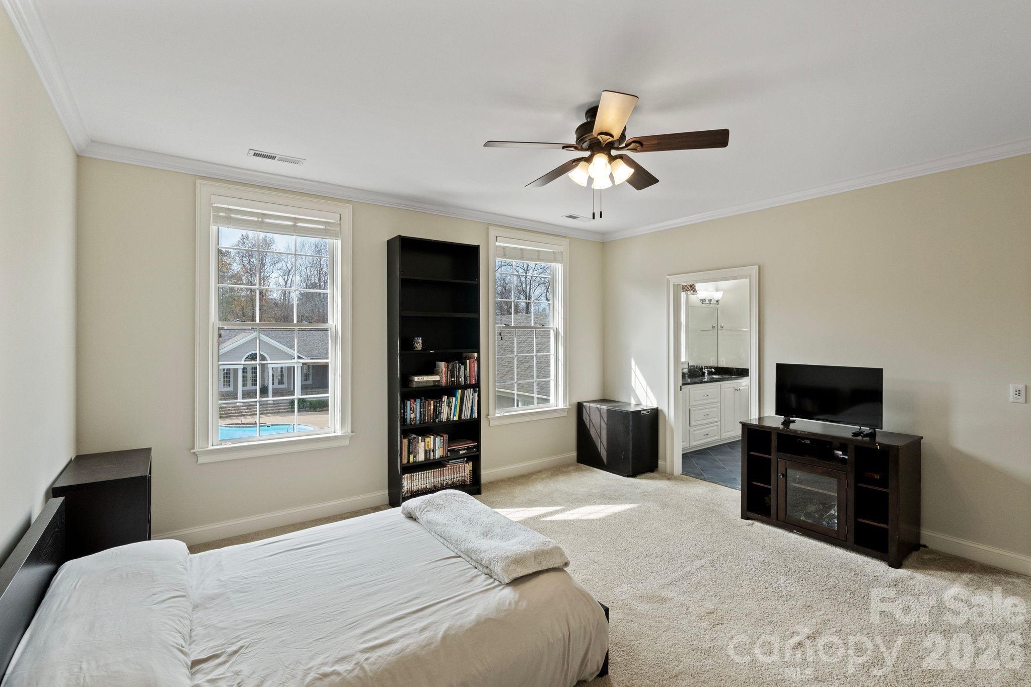 393 Youngs Bend Road Kershaw, SC 29067 - Photo 34 of 48 a bedroom with a bed dresser and a flat tv screen
