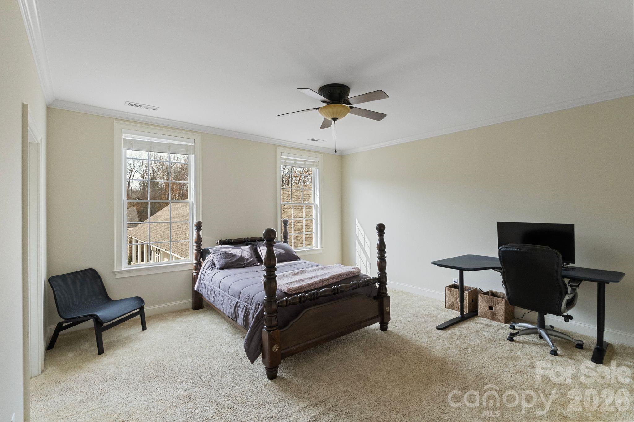 393 Youngs Bend Road Kershaw, SC 29067 - Photo 36 of 48 a bedroom with a bed a chair and a window
