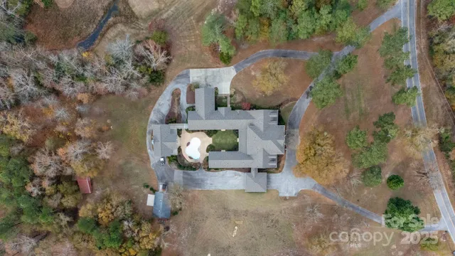 an aerial view of a house with outdoor space