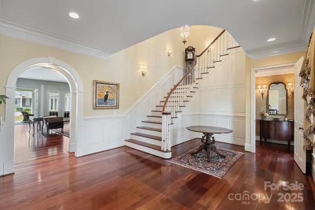 a view of entryway and hall with wooden floor