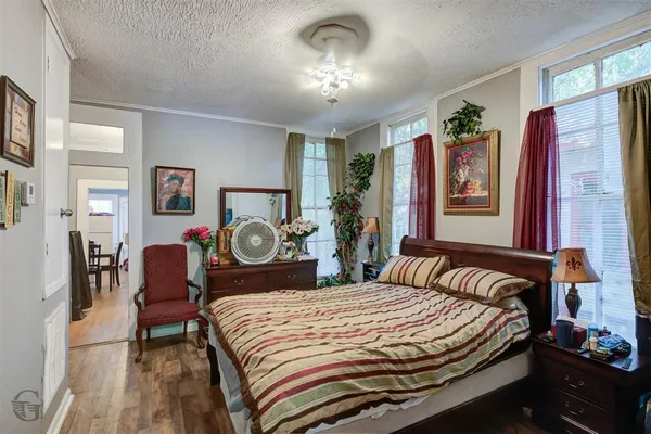 a bed room with a bed and a chandelier