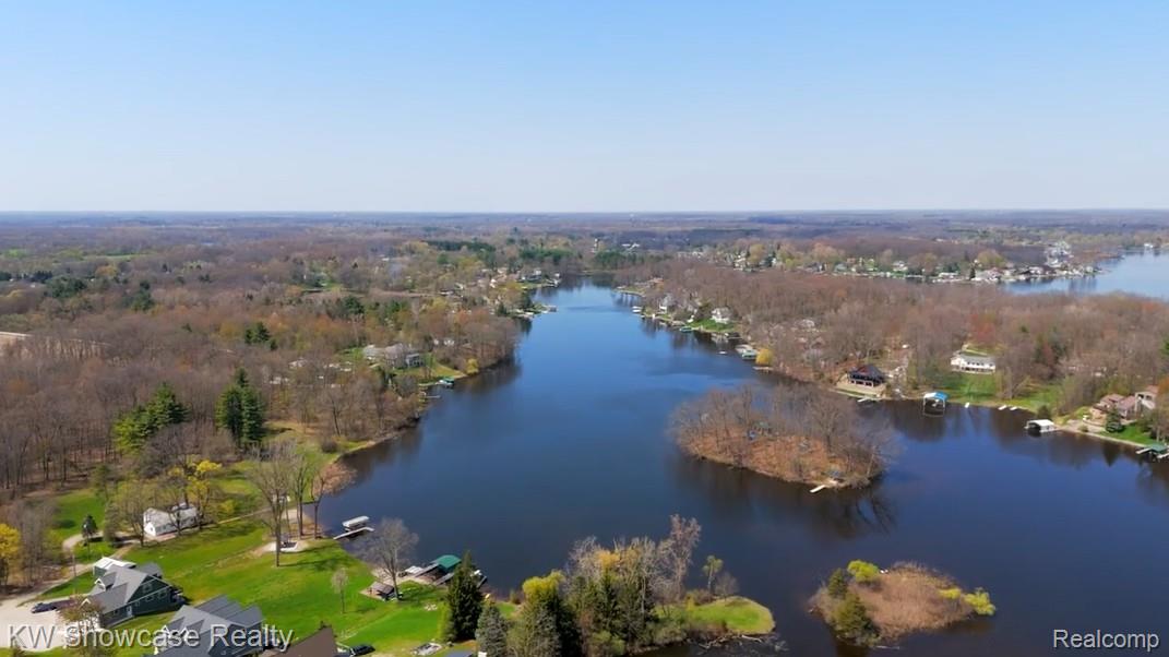 6354 Bennett Lake Road Fenton, MI 48430 - Photo 10 of 41 Bird's eye view of a nearby body of water and a forest