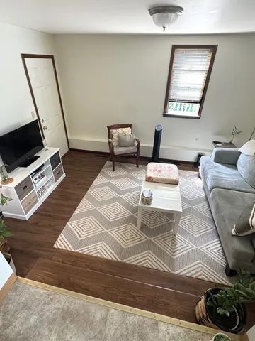 a bedroom with furniture and a mirror