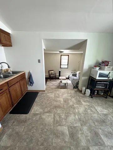 a bed room with furniture and a window